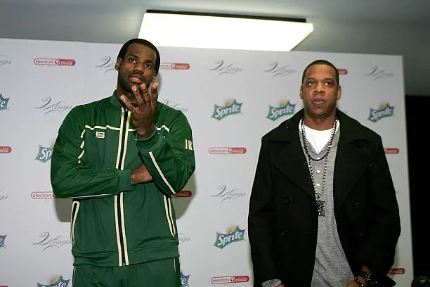 Superstar LeBron James and producer/rapper Shawn "Jay-Z" Carter speak to reporters before meeting with kids at the Dallas Boys & Girls Club on...